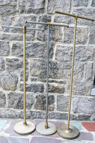 Collection of Industrial Garment Racks: Collection of 3 Industrial Garment Racks. Largest measures 70 inches x 30 inches x 4 inches.