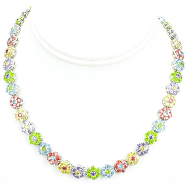 Articulated Floral Motif Rhinestone Necklace: Costume Jewelry Articulated Floral Motif Rhinestone Necklace. Measures 16 inches in length.