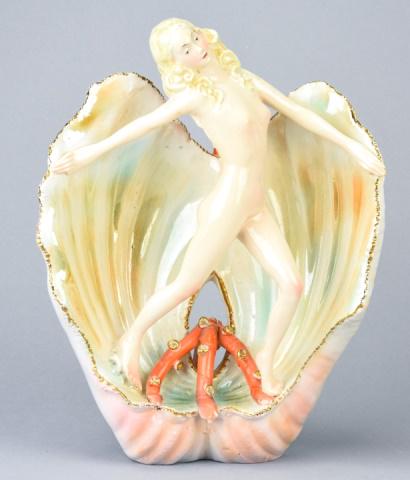 Italian Art Deco Porcelain Statue Nude on Seashell: Italian Art Deco Porcelain Statue of Female Nude on Seashell. Marked "Italy" on bottom. Measures 11.25 inches x 8.5 inches x 4 inches.