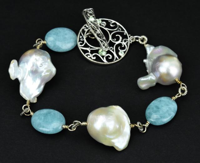 Cultured Baroque Pearl & Amazonite Bead Bracelet: Cultured Baroque Pearl & Amazonite Bead Bracelet. Set with three large cultured baroque pearls, largest is approximately 25 mm in length. Bracelet measures 8.25 inches in length. Features large decora