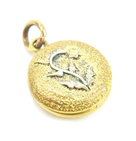 Antique 19th C Gold Topped Floral Motif Locket: Antique 19th C Gold Topped Floral Motif Locket Necklace Pendant. Gold filled locket with applied gold flower. Measures 1 inch in length.