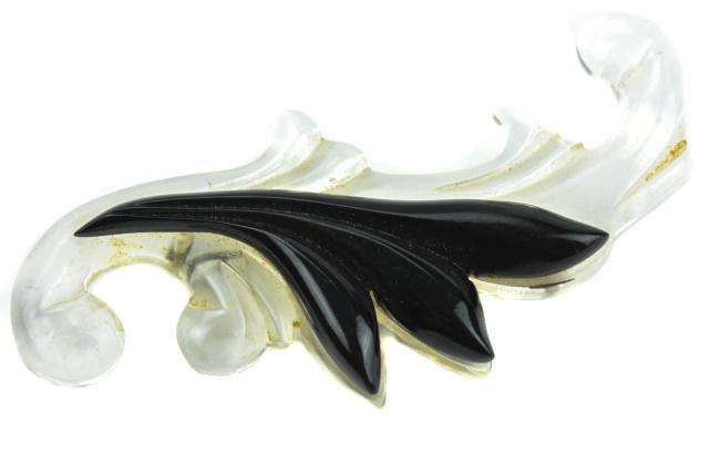Vintage Carved Lucite Figural Scroll Brooch: Vintage Carved Lucite Figural Scroll Brooch. Mid Century costume jewelry carved acrylic brooch. Measures 4 inches in length.