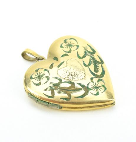 Estate Gold Filled Heart Form Locket Pendant: Estate Gold Filled Heart Form Locket Pendant. Floral motif. Measures just over 1 inch in length.