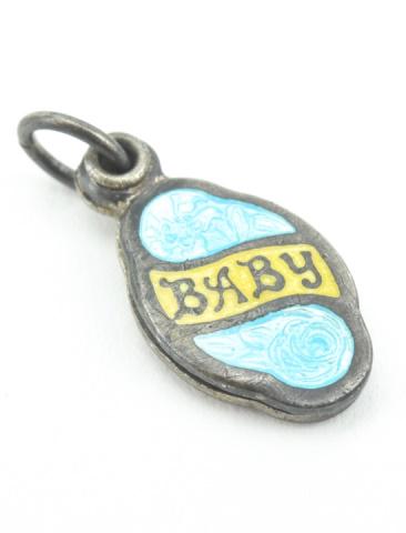 Antique Enamel Locket Pendant " Baby ": Antique Enamel Locket Pendant " Baby " Measures .75 of an inch in length.
