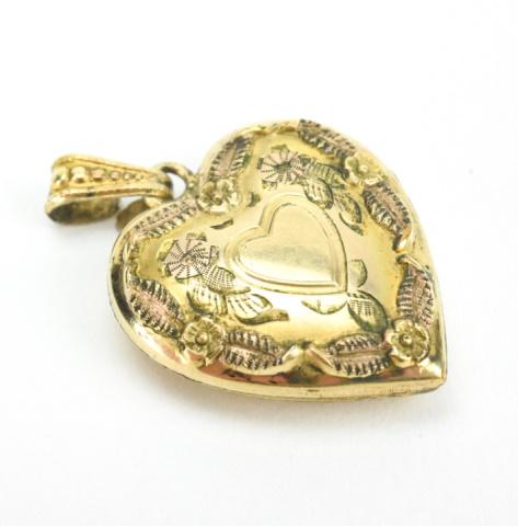 Gold Filled Heart Locket with Floral Motif: Gold Filled Heart Locket with Floral Motif. Measures 1.25 inches in length.