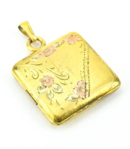 Antique Gold & Rose Tone Floral Motif Locket: Antique Gold & Rose Tone Floral Motif Locket. Measures 1.25 inch in length.