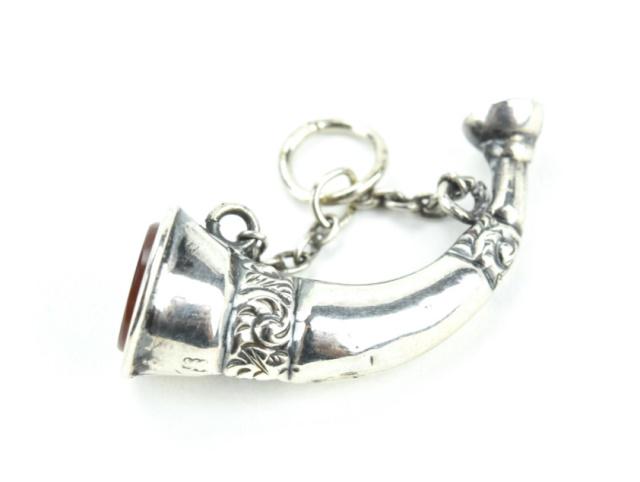 Antique English Sterling & Carnelian Horn Pendant: Antique English Sterling Silver & Carnelian Horn Pendant. Hallmarked. Hunting horn design. Necklace pendant / charm / fob. Measures 1 inch in length.