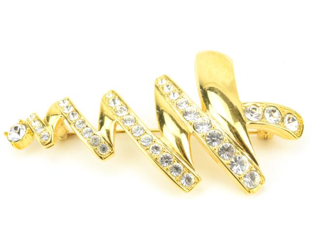 Vintage Monet Costume Jewelry Christmas Brooch: Vintage Monet Costume Jewelry Christmas Brooch. Gilt metal and rhinestone. Signed. Measures 2.75 inches in length.