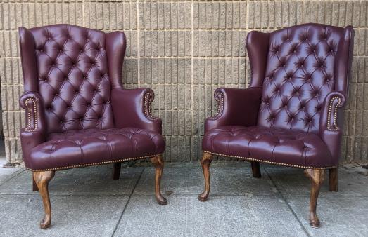 Pair Maroon Leather & Mahogany Wingback Arm Chairs: Pair Maroon Leather & Mahogany Wingback Arm Chairs. Both measure 40.5 inches x 24 inches x 23 inches with a seat height of 17 inches.