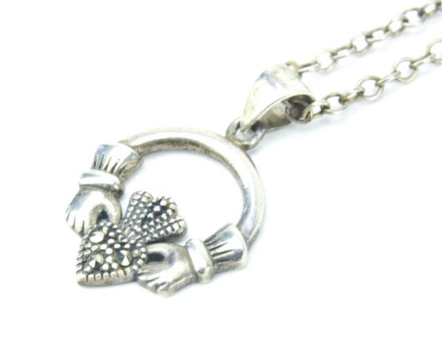 Sterling Silver & Marcasite Claddagh Necklace: Sterling Silver & Marcasite Claddagh Necklace. Hallmarked. Chain measures 16.5 inches in length.