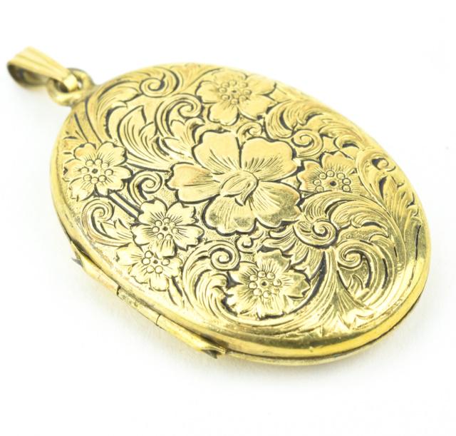 Estate Gold Filled Floral Motif Locket Pendant: Estate Gold Filled Floral Motif Locket Pendant. Measures 1.75 inches in length.