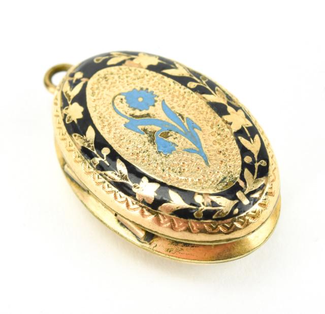 Antique 19th C 10 KT Gold & Enamel Locket: Antique 19th C 10 KT Gold & Enamel Locket Oval form locket necklace pendant. Front with black and Persian turquoise blue enamel floral decoration. Front and back with lily of the valley design. Acid t