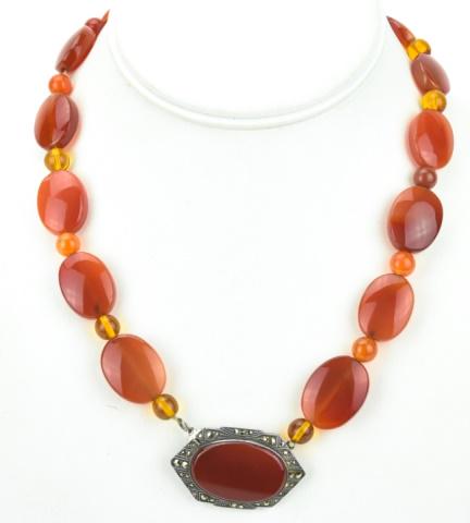 Antique Art Deco Carnelian & Marcasite Necklace: Antique Art Deco Carnelian & Marcasite Necklace. Having carved carnelian and amber tone glass beads with sterling silver pendant / clasp set with rose cut marcasites. Measures approximately 17.5 inche