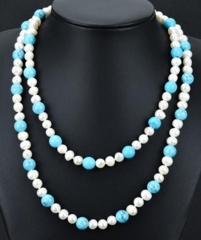 Turquoise & Baroque Pearl Opera Length Necklace: Turquoise Bead & Baroque Pearl Opera Length Necklace Strand Opera length necklace strand with alternating pattern of veined turquoise beads and high luster baroque pearls. Measures 32 inches in length