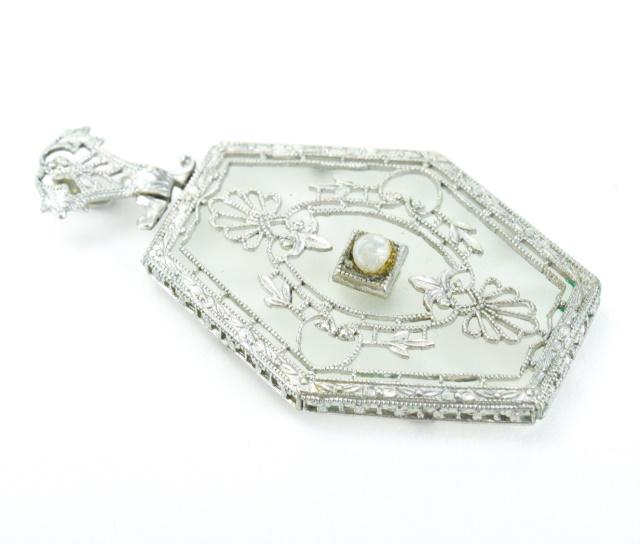 Edwardian Style Cut Camphor Glass Pendant: Edwardian Style Cut Camphor Glass Pendant. Measures just under 1.5 inches in length.