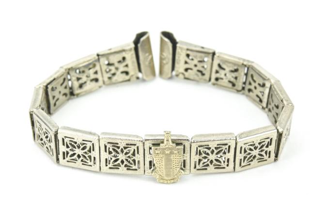 Edwardian Articulated Panel Bracelet w Shield: Edwardian Articulated Panel Bracelet with Armorial Shield. Measures 5.25 inches in length.