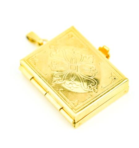 Vintage Book Form Locket Pendant w Fold Out Frame: Vintage Book Form Locket Pendant w Fold Out Frame. Can hold four photos. Measures 1.5 inches in length.
