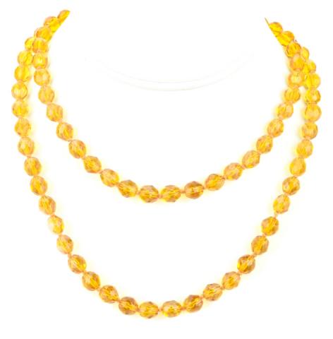 Antique Art Deco Citrine Glass Necklace: Antique Art Deco Citrine Glass Necklace Hand knotted, Flapper-era necklace with faceted citrine glass beads. Measures 33 inches in length.