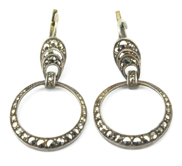 Antique Art Deco Sterling & Marcasite Earrings: Antique Art Deco Sterling & Marcasite Earrings. Door knocker form. Hallmarked on ear wire. Each measures 1.5 inches in length.