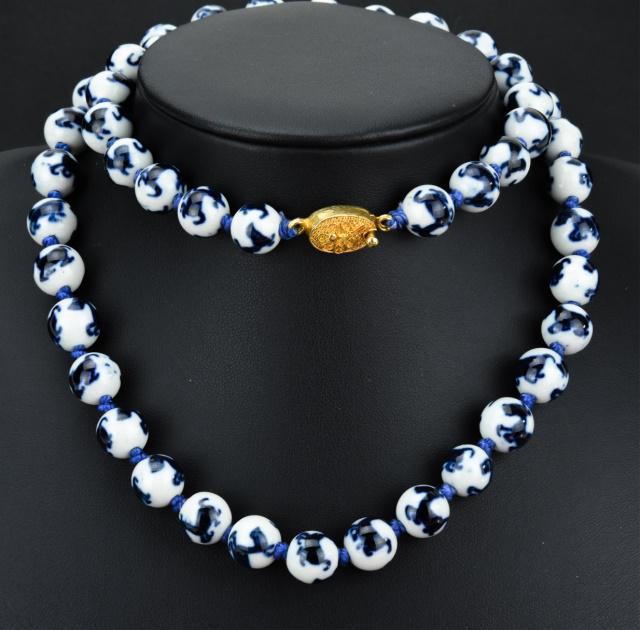 Estate Chinese Hand Painted Porcelain Necklace: Estate Chinese Hand Painted Porcelain Necklace. Hand knotted on silk thread and featuring blue and white hand painted porcelain beads. Measure just over 25 inches in length.