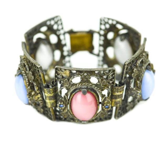 Vintage Costume Jewelry Bracelet w Rotating Stones: Vintage Costume Jewelry Bracelet w Rotating Stones. Articulated panel bracelet with double sided cabochon centers that rotate / spin. Each panel is also set with rhinestones. Measures 7.5 inches in le