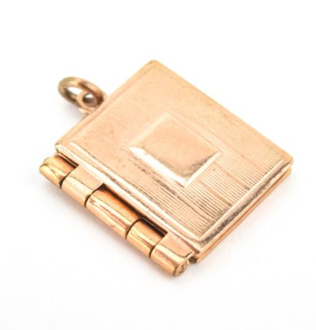 Vintage Gold Filled Book Form Locket Pendant: Vintage Gold Filled Book Form Locket Pendant. Measures just over .75 of an inch in length.