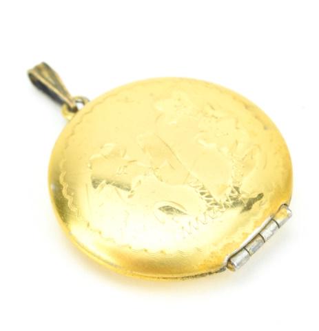 1940s Gold Filled Round Locket w Floral Motif: 1940s Gold Filled Round Locket with Floral Motif. Measures 1.25 inches in diameter,