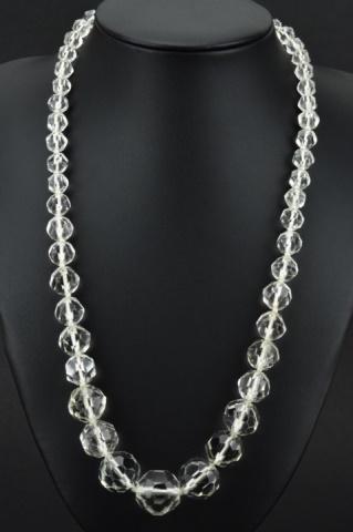 Antique Art Deco Faceted Rock Crystal Necklace: Antique Art Deco Faceted Rock Crystal Necklace. Hand knotted and featuring graduated size faceted rock crystal beads with filigree navette clasp. Measures 20.5 inches in length.