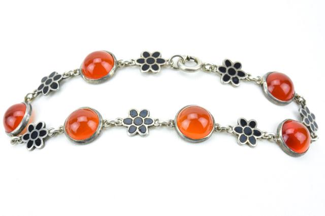Sterling Silver Black Enamel Carnelian Bracelet: Sterling Silver Black Enamel Cabochon Carnelian Bracelet. Measures 7 inches in length.