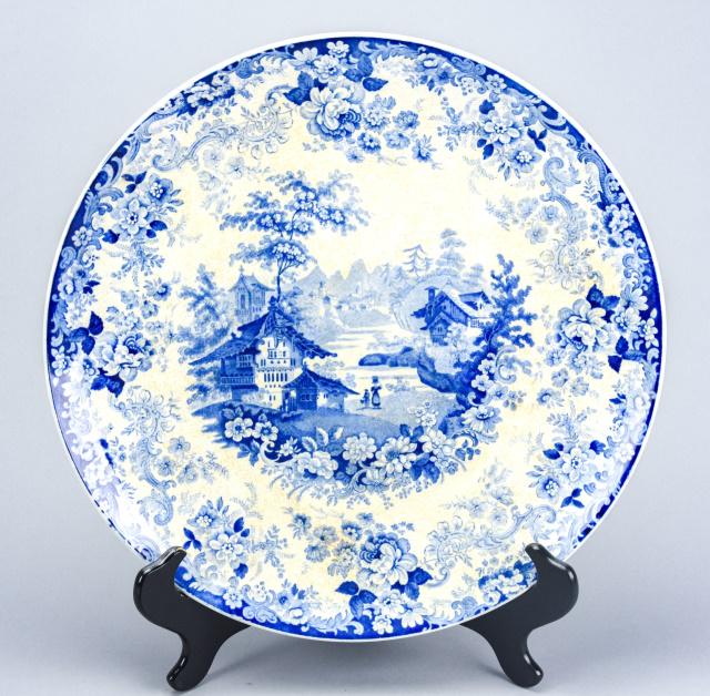 Antique Mintons Blue & White Ironstone Charger: Antique 19th Century Mintons Blue & White Transferware Ironstone Charger. Charger with scrolled floral border and Chinese village scene. Marked on back. Measures 15 inches in diameter.