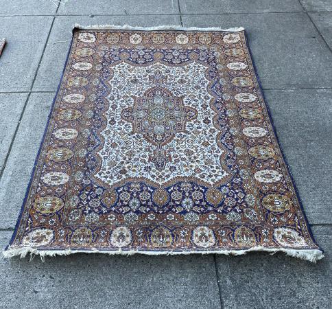 Persian Hand Knotted Area Rug w Center Medallion: Persian Hand Knotted Area Rug with Center Medallion. Having royal blue, rust, and ochre colorways. Measures 72 inches x 46 inches.