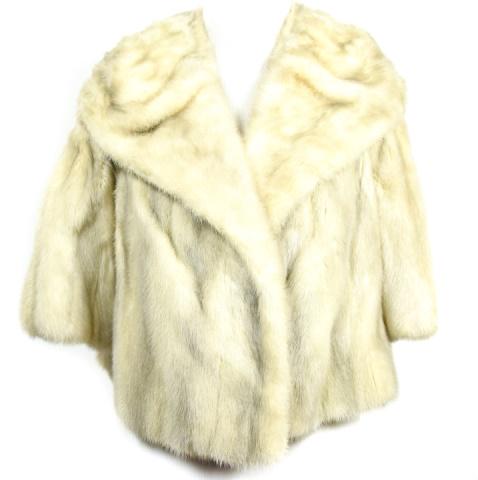 White Mink Fur Womens Shrug: White Mink Fur Womens Shrug. Shoulders measure 20 inches. Sleeve measures 10 inches. Length measures 18 inches.