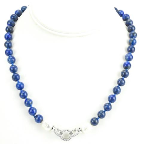 Hand Knotted Lapis Lazuli & Baroque Pearl Necklace: Hand Knotted Lapis Lazuli & Baroque Pearl Necklace. Hand knotted on silk thread with pave set clasp. Measures 19 inches in length.