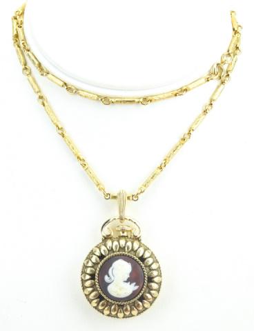 Vintage Costume Jewelry Cameo Locket on Chain: Vintage Costume Jewelry Cameo Locket on Chain. GIlt metal. Chain measures 23 inches in length.
