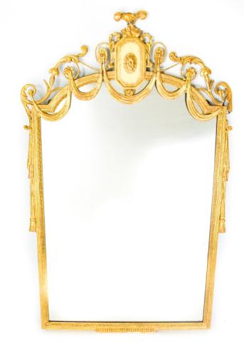 Antique French Empire Carved Giltwood Mirror: Antique French Empire Carved Giltwood Mirror. Carved crest with central patera, flanked by ribbon swag and scrolling acanthus leaves. Measures 45 inches high x 28 inches wide.