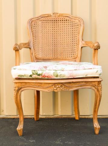 Louis XV Style Carved & Caned Armchair: Louis XV Style Carved & Caned Armchair. Measures 33 inches x 22 inches x 19 inches.