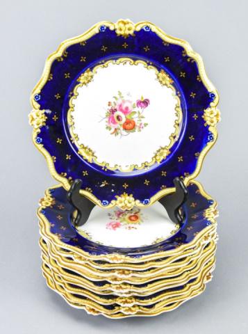Set 10 Hand Painted Floral Porcelain Plates: Set 10 Hand Painted Porcelain Plates w Floral Detail. Plates have blue rims with cream and gold toned hand painted detail. Measures 9 inches x 9 inches.