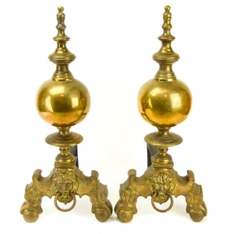 Pair French Empire Style Brass Lion Head Andirons: Pair French Empire Style Brass Lion Head Andirons. Measures 22 inches high x 9.5 inches wide x 10 inches deep.