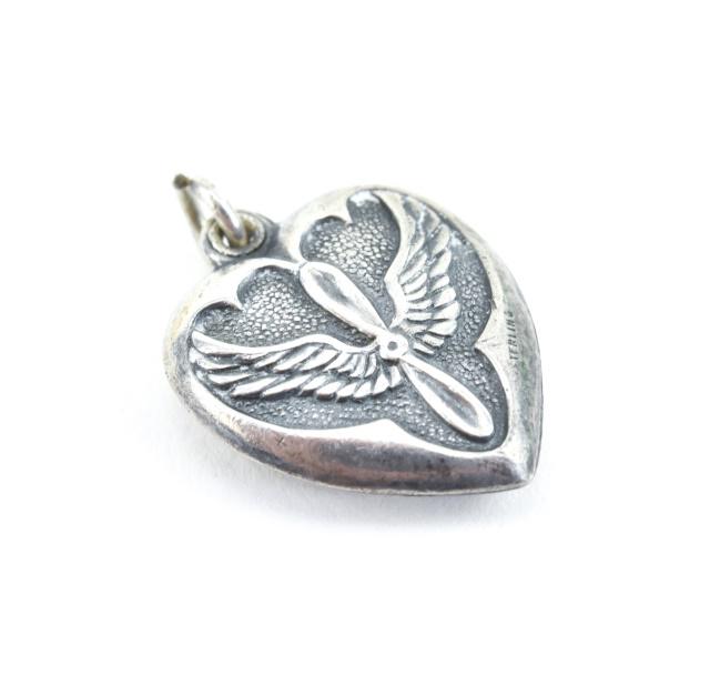 Antique WWII Sterling Silver Air Force Heart Charm: Antique WWII Sterling Silver Air Force Heart Charm or Necklace Pendant. Measures just over .75 of an inch in length.