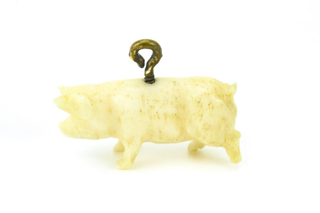 Antique Hand Carved Bone Pig Pendant or Charm: Antique Hand Carved Bone Pig Pendant or Charm. Measures nearly .75 of an inch in length.