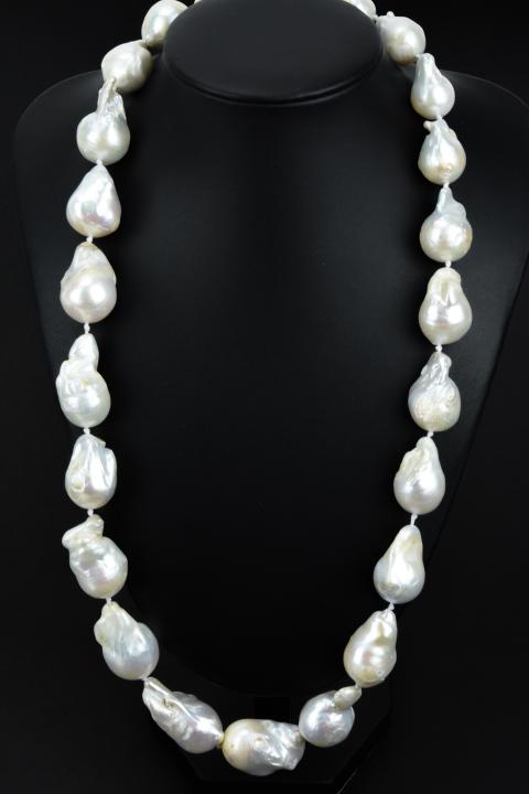 Impressive Cultured Baroque Pearl Necklace Strand: Impressive Cultured Baroque Pearl Necklace Strand. Hand knotted on white silk thread and featuring high luster cultured baroque pearls from Ha Long Bay area of Vietnam. These pearls are white with iri