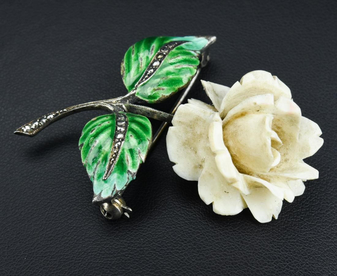 Sterling Enamel Marcasite & Bone Rose Brooch: Vintage Sterling Enamel Marcasite & Bone Rose Brooch. Sterling silver set with marcasite. Leaves are hand painted enamel and rose flower is hand carved bone. Hallmarked. Measures 2 inches in length.