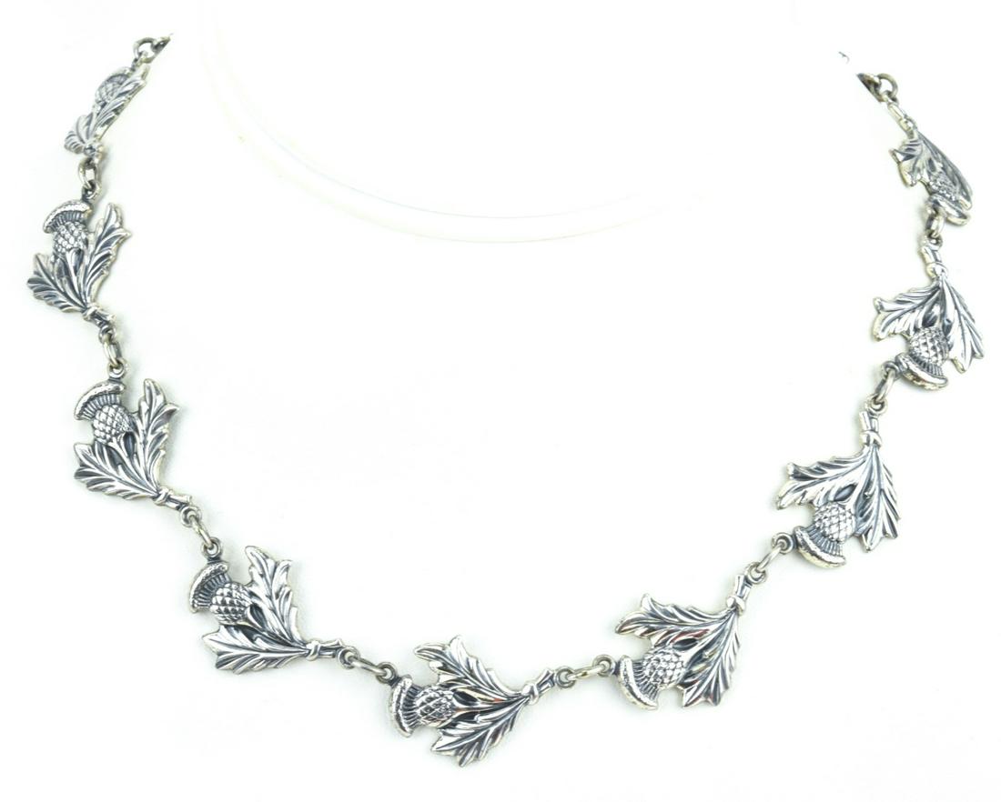 Sterling Silver Scottish Thistle Motif Necklace: Sterling Silver Scottish Thistle Motif Necklace. Hallmarked. Articulated. Measures 16 inches in length.
