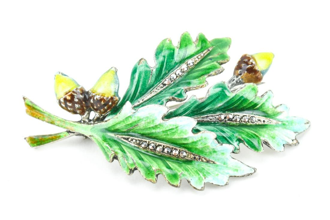 Vintage Germany Sterling & Enamel Acorn Brooch: Vintage Germany Sterling & Enamel Acorn Brooch. Sterling silver, marcasite and hand painted enamel spray brooch with leaves and acrons. Hallmarked. Measures 2 inches in length.