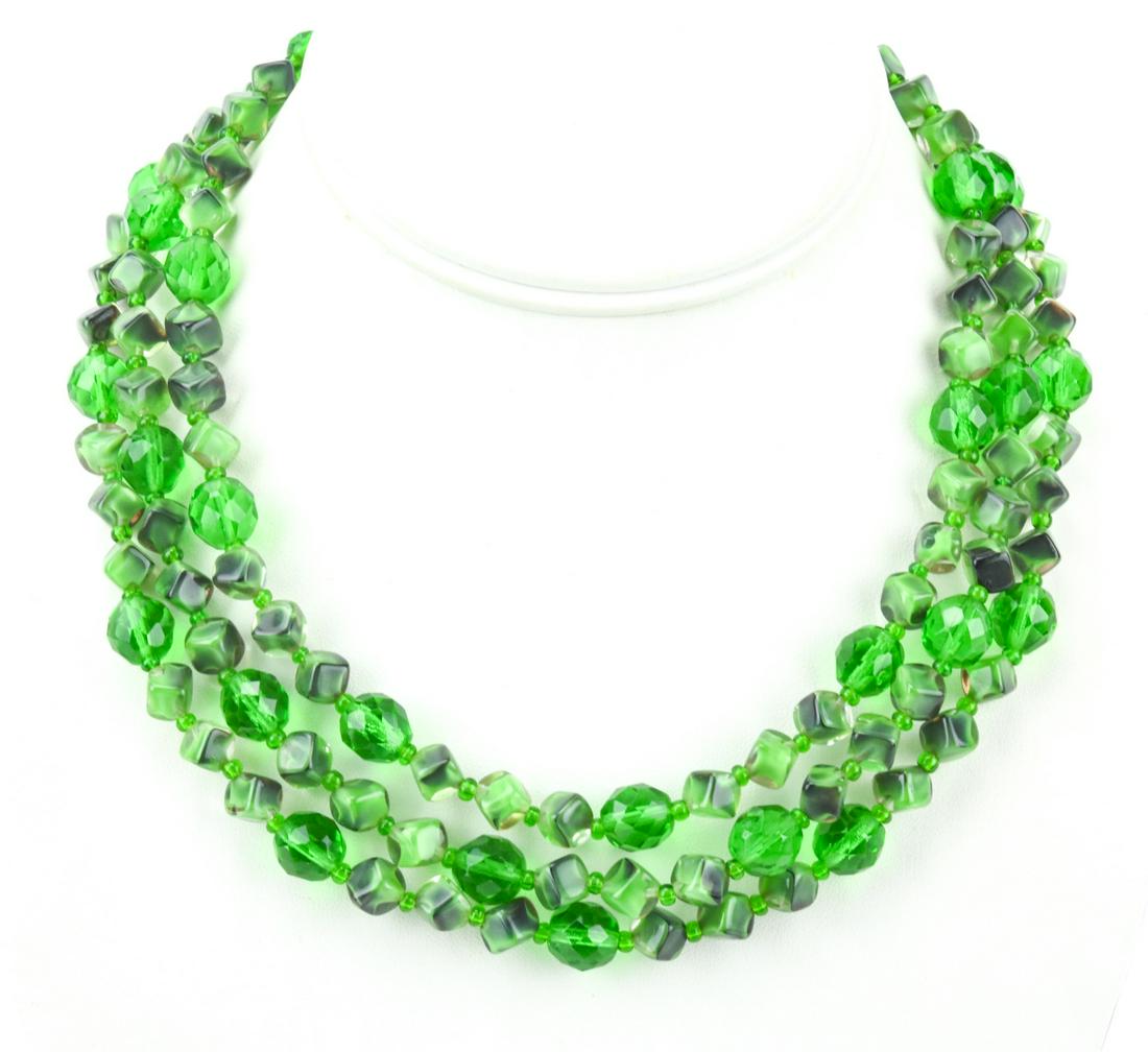 Vintage Malachite & Emerald Glass Necklace: Vintage Triple Strand Costume Jewelry Malachite Glass & Emerald Paste Beaded Necklace. Measures 17.5 inches in length.