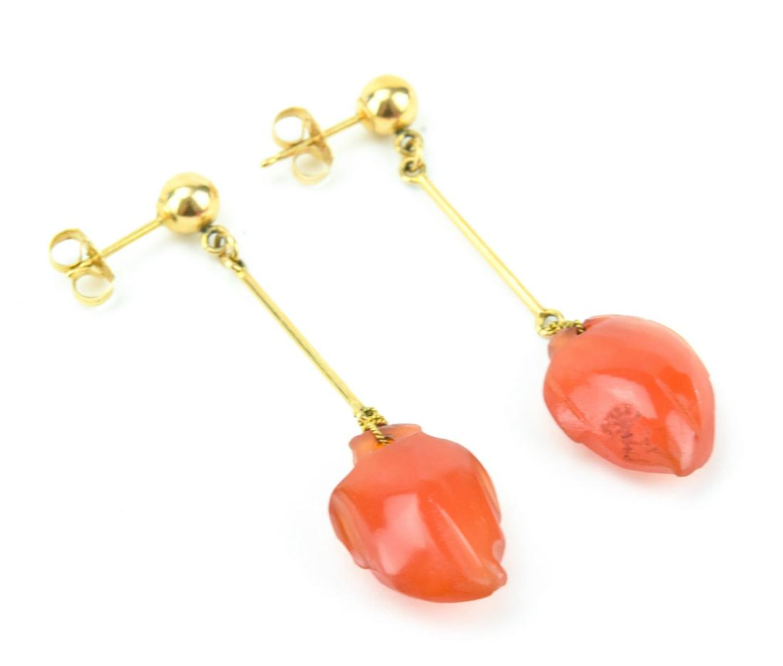 Antique Chinese 14K Gold & Carnelian Earrings: Pair Antique Chinese 14K Gold & Carved Carnelian Pendant Earrings. Hallmarked. Measures 1.75 inches in length.