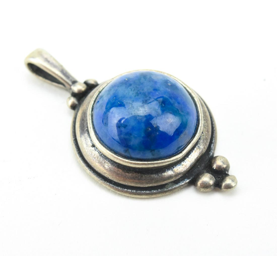 Sterling Silver Cabochon Sodalite Necklace Pendant: Sterling Silver Cabochon Sodalite Necklace Pendant. Measures 1 inch in length.
