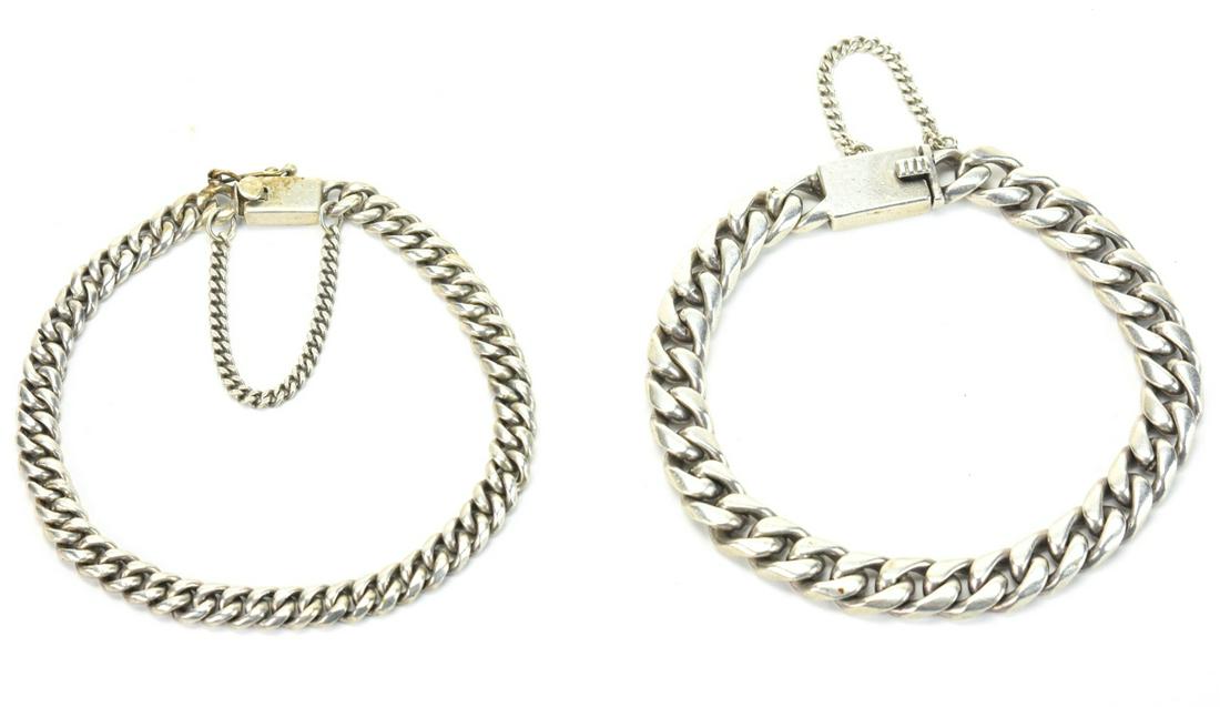 Pair Mens Modernist Sterling Silver Link Bracelets: Pair Men's Modernist Sterling Silver Link Bracelets with Safety Chains. Approximately 44 grams. Approximately 8 inches in length.