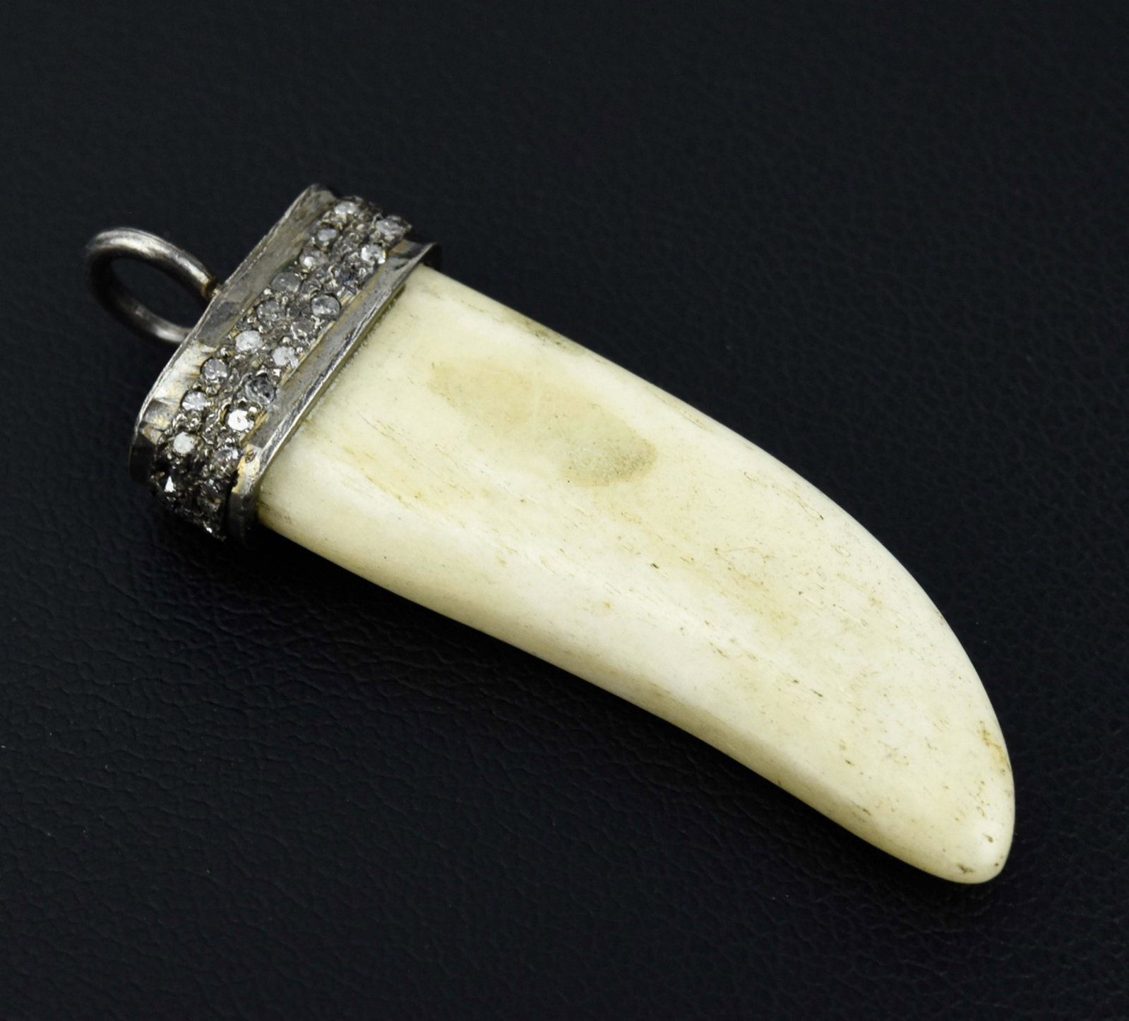 Pave Diamond Set & Sterling Silver w Bone Pendant: Pave Diamond Set & Sterling Silver w Bone Pendant. Horn design carved bone, top with sterling silver mount and bail set with two rows of pave diamonds. Measures 1.5 inches in length.