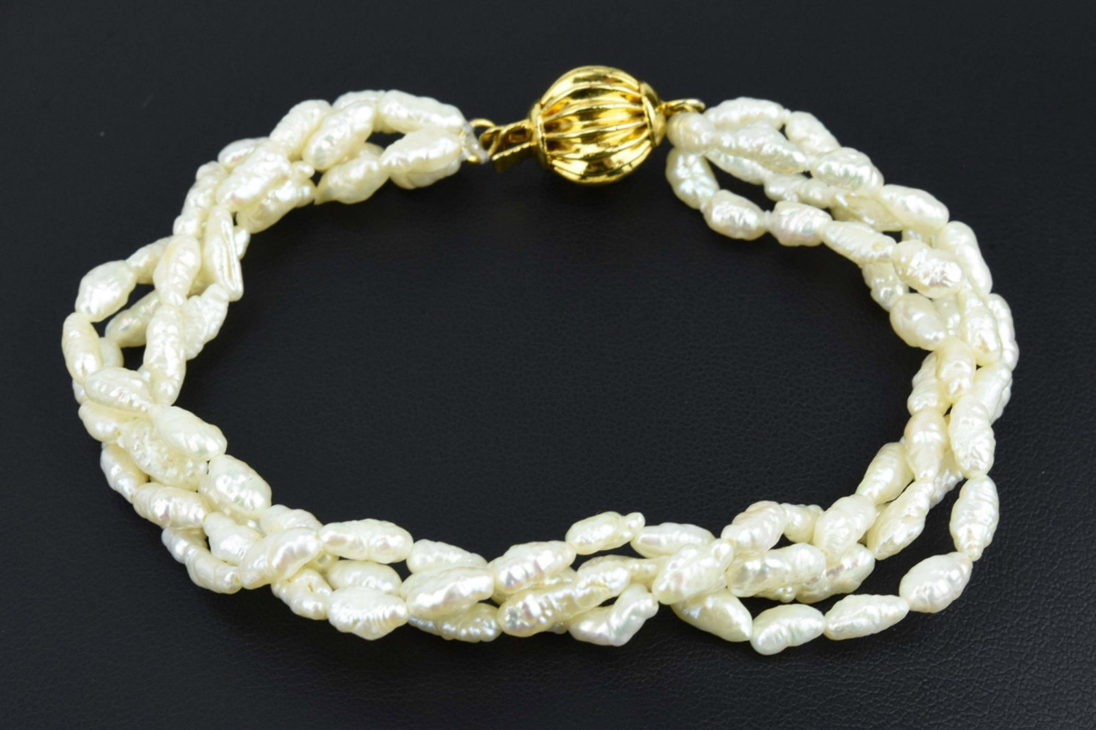 Multi Strand Baroque Seed Pearl Bracelet: Multi Strand Baroque Seed Pearl Bracelet Measures 8 inches in length.